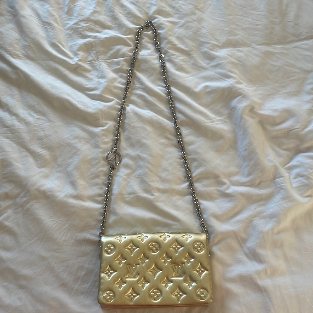 Louis Vuitton gold embossed pochette coussin with adjustable silver logo chain
